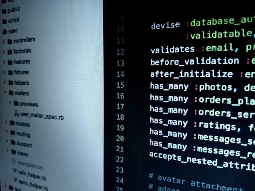 A close-up photograph of a computer screen displaying lines of colorful HTML and CSS code on a dark background. The code is presented in multiple colors including red, green, blue, and purple, indicat